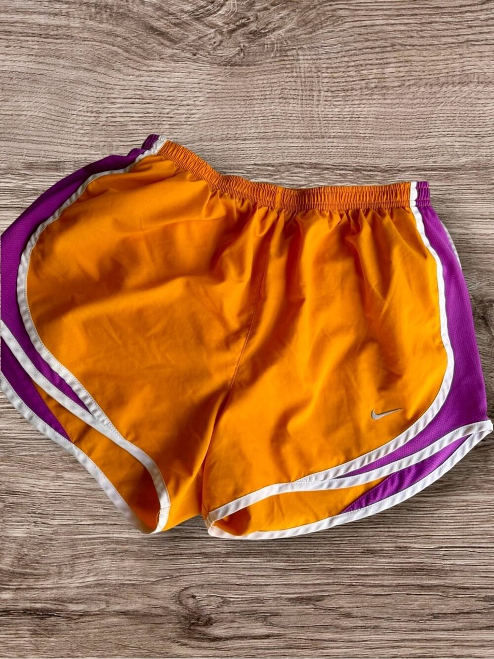Nike orange and purple dri fit shorts.  Medium